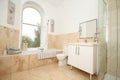 Marble tiled modern bathroom with shower unit