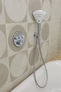 Marble wall and shower head. Modern bathroom design