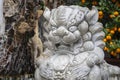 Marble white lion statue in outdoors park, Vietnam. Close up Royalty Free Stock Photo