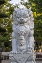 Marble white lion statue in outdoors park, Vietnam. Close up Royalty Free Stock Photo