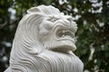 Marble white lion statue in outdoors park, Vietnam. Closeup Royalty Free Stock Photo