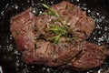 Marbled beef steak is fried in oil in a frying pan. Royalty Free Stock Photo