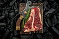 marbled beef T-bone or porterhouse beef meat Steak on BBQ grill coal. Fresh meat for grilling. steak raw striploin of beef. top Royalty Free Stock Photo