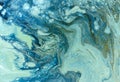 Marbled blue and golden abstract background. Liquid marble pattern