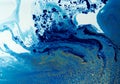 Marbled blue and golden abstract background. Liquid marble pattern