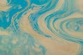 Marbled marine abstract background. Liquid acrylic marble pattern with blue and gold