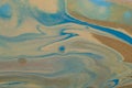 Marbled marine abstract background. Liquid acrylic marble pattern with blue and gold