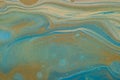 Marbled marine abstract background. Liquid acrylic marble pattern with blue and gold