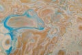 Marbled marine abstract background. Liquid acrylic marble pattern with blue and gold