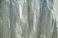 Marbled pattern of a smooth gray stone slab, natural stone cut and polished
