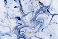 Marbled unique blue abstract background with gold dust