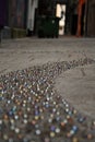 Marbles embedded on pavement Royalty Free Stock Photo