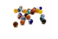Marbles spread on white Royalty Free Stock Photo
