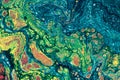 Marbling textured creative background. Mixing green, red, blue colors handmade surface