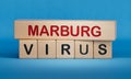 Marburg virus symbol. White note with words Marburg virus,Copy space. Royalty Free Stock Photo