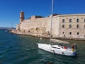 Marceille, France - may 8, 2017: Yacht Sailing near the fort of Old port. Military defence architecture. Bareboat charter. Mediter Royalty Free Stock Photo