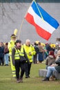 7 March, 2021, Amsterdam, Netherlands, Yellow umbrella`s protest against covid-19 measures and vaccination