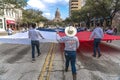 MARCH 3, 2018 - AUSTIN TEXAS - University of Texas students carry Texas flag down Congress Avenue. TexasCarryingFlagGulf, coa