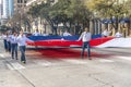 MARCH 3, 2018 - AUSTIN TEXAS - University of Texas students carry Texas flag down Congress Avenue. Coast, Flag