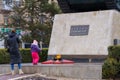 March 8, 2022 Balti, Moldova. Illustrative editorial. A girl lays flowers at the monument with eternal flame