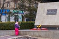 March 8, 2022 Balti, Moldova. Illustrative editorial. A girl lays flowers at the monument with eternal flame