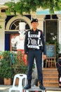 Bangkok, Thailand. A young policeman stands guard outside. Thai police. Man in uniform