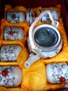 8 March 2020, Bangsar south, Kuala lumpur, Malaysia. A white tea set with colorful patterns in a yellow fabric box.