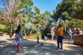 March 2017, Barcelona, Spain - Man blowing giant bubbles in the Guel park. Street performer inflating huge bubbles for