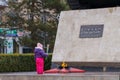 March 8, 2022 Balti, Moldova. Illustrative editorial. A girl lays flowers at the monument with eternal flame