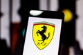 Logo of the Formula 1 `Scuderia Ferrari Mission Winnow` team on the screen of the mobile device Royalty Free Stock Photo