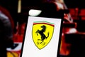 Logo of the Formula 1 `Scuderia Ferrari Mission Winnow` team on the screen of the mobile device Royalty Free Stock Photo