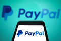 March 5, 2024, Brazil. The PayPal logo is displayed on a smartphone screen and in the background Royalty Free Stock Photo