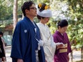 Bride and groom follow walk to Atsuta Shrine, Nagoya, Japan