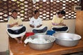 March 25, 2014. Cambodia: unidentified girls sat spinning silk b