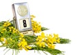 8 March card - vintage desk calendar with 8 March date and mimosa flowers isolated on white