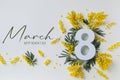 8 March celebration with number eight and text decorated with spring mimosa flowers top view. Happy Women Day Royalty Free Stock Photo