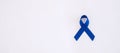 March Colorectal Cancer Awareness month, dark Blue Ribbon for supporting people living and illness. Healthcare, hope and World