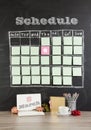 8 March concept: grid timetable schedule with decoration on black chalkboard background. Royalty Free Stock Photo