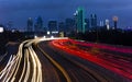 MARCH 5, 2018, DALLAS SKYLINE TEXAS, and Tom Landry Freeway, with streaked lights on Interstate 30. Texas, evening