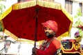 13-March 2022 Dang Ahwa Gujarat- India, A man in Tradition Dress with Red Traditional decorated umbrella