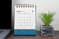 2024 March Desk Calendar on Blue Background
