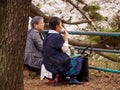 Elderly couple views Sakura flowers, Nagoya, Japan