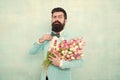 8 march. Flower bouquet for womens day. Bearded man with tulips. Flowers shop. Ideas to celebrate. Spring mood. Love