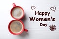 8 March greeting card design with cups of coffee on white wooden background, flat lay. Happy Women`s Day