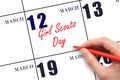 March 12. Hand writing text Girl Scouts Day on calendar date. Save the date. Royalty Free Stock Photo