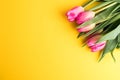 8 March Happy Women`s Day concept. With wooden block calendar and pink tulips on yellow background. Copy space Royalty Free Stock Photo