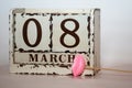 8 March Happy Women`s Day with wooden block calendar and pink lips on a stick