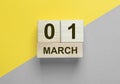 1 March inscription on wooden calendar. Hello spring