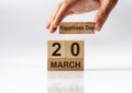 20 March inscription on wooden calendar. International happiness day