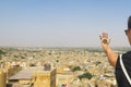 Henna tattoo hand and panoramic view over the Indian desert town Jaisalmer Royalty Free Stock Photo